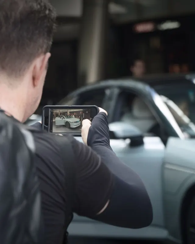 Visitors photographing the AFEELA