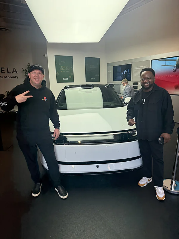 Larry and a colleague with the AFEELA 1 at the studio